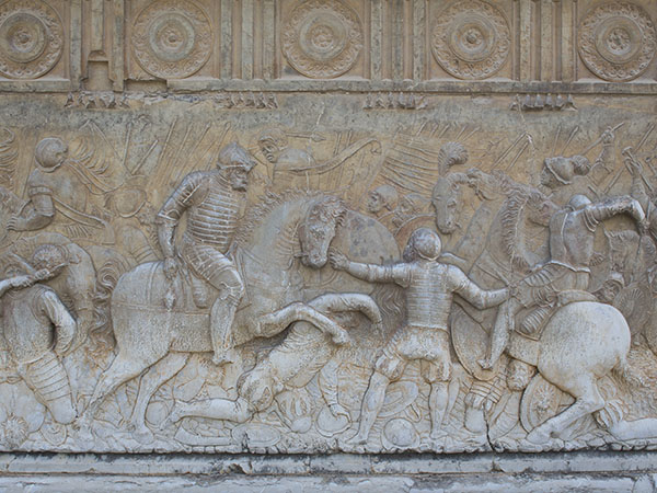 Detail of the reliefs on the base of the main entrance representing scenes from the Emperor's military campaigns