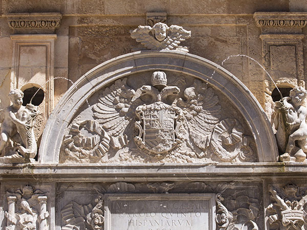 Curved pediment crowning the basin with the Emperor’s arms